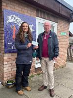Benhall School Grant Presentation Dorothy Tomalin PTA with Rotarian Nigel Gilhead.